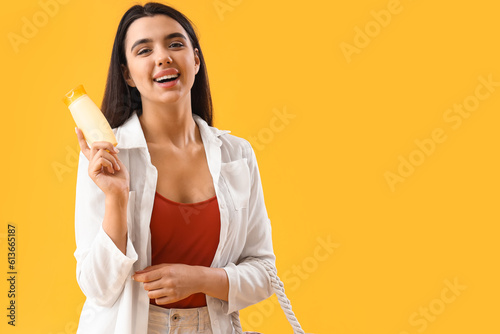 Young woman with sunscreen ...