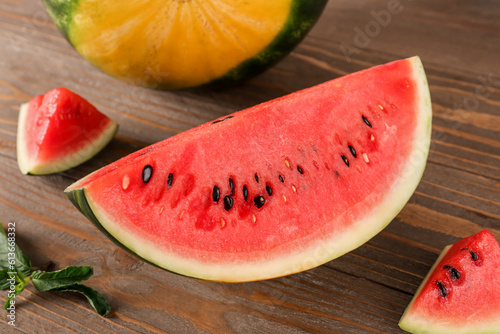 Pieces of fresh watermelon on wooden table