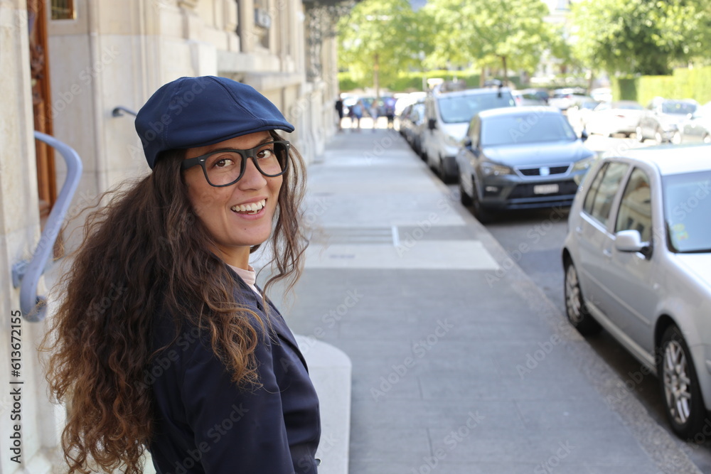 Beautiful elegant woman posing in city street Beautiful elegant woman posing in city street