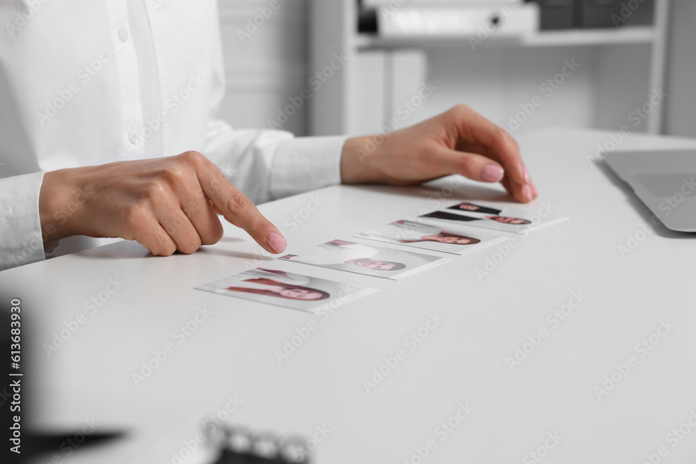 Human resources manager choosing employee among different applicants at table in office, closeup Human resources manager choosing employee among different applicants at table in office, closeup