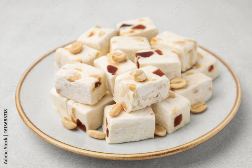 Pieces of delicious nutty nougat on light table