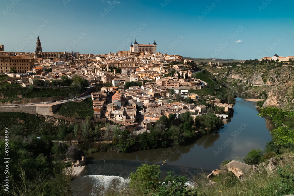 Panoramic landscape with beautiful blue sky and view of the Tagus river in the city of Toledo, Spain.