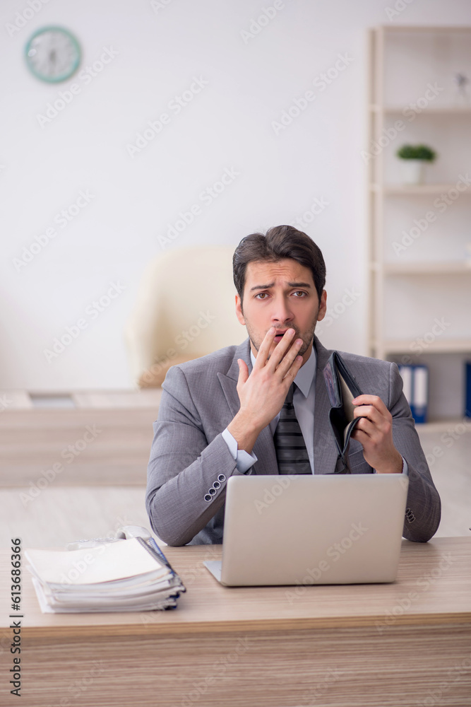 Young male employee in remuneration concept