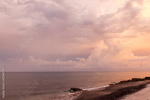 Beautiful sunset on the ocean. Beautiful landscape at sunset, pink and orange sky, beach. Background for summer holidays. Spectacular sunset sky in Florida