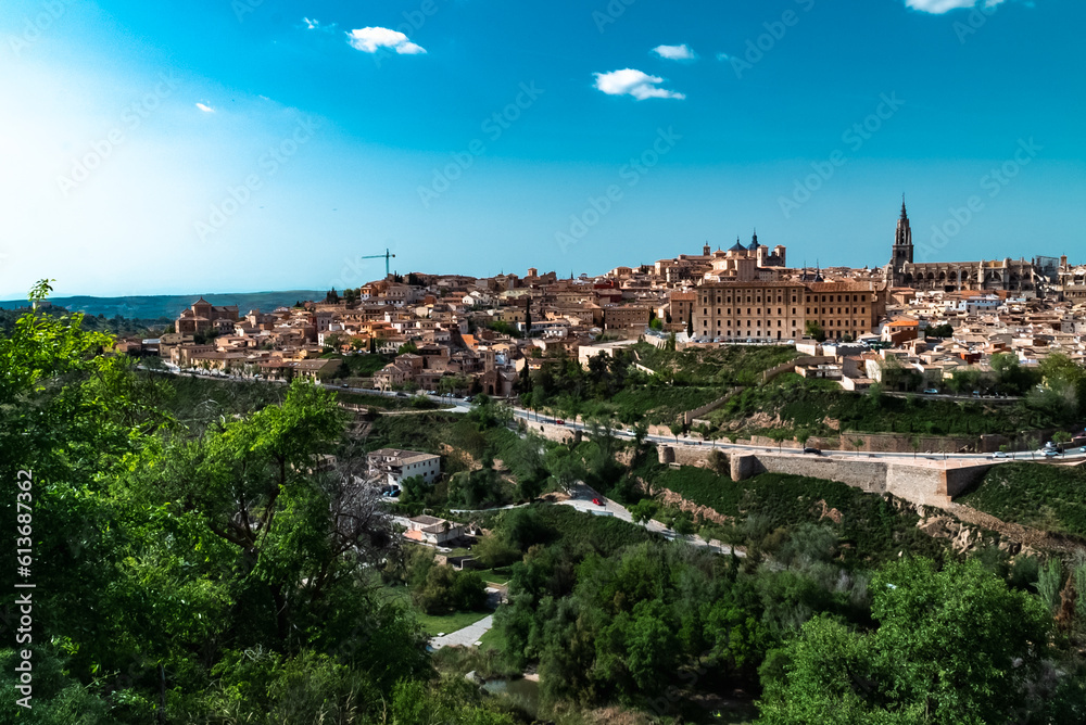 Panoramic landscape with beautiful blue sky and view of the Tagus river in the city of Toledo, Spain.