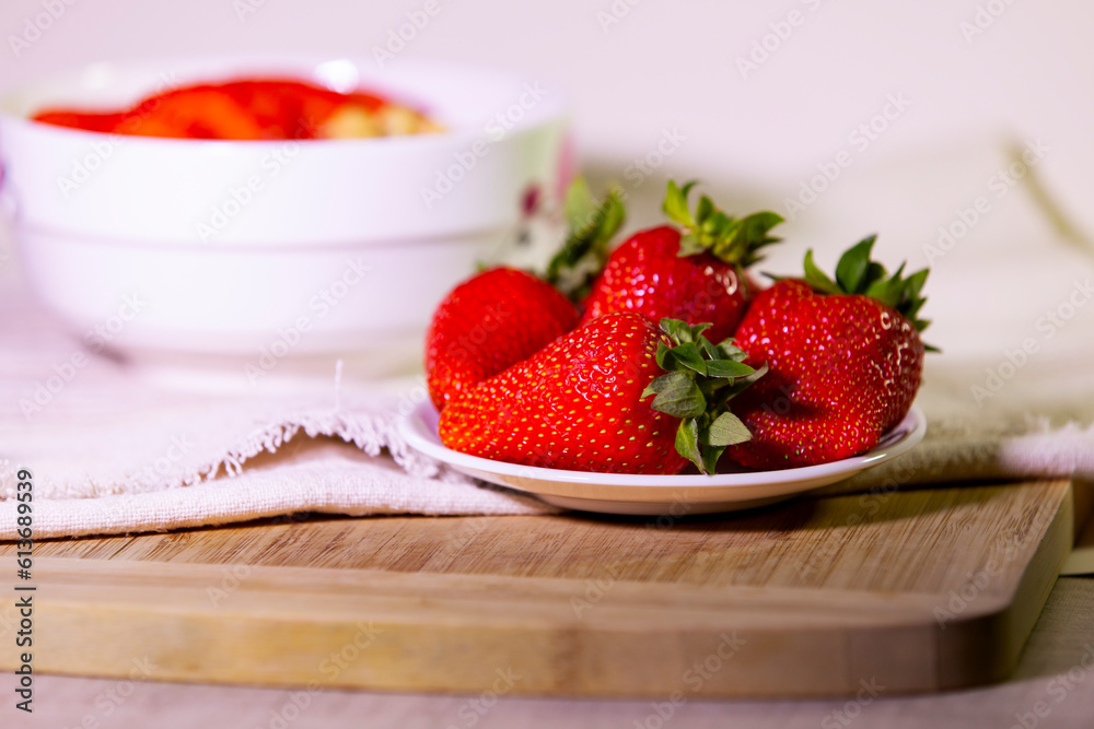 Big juicy strawberries on a plate.
