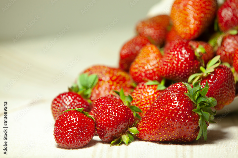 Big juicy strawberries on a napkin. Closeup with copy space.