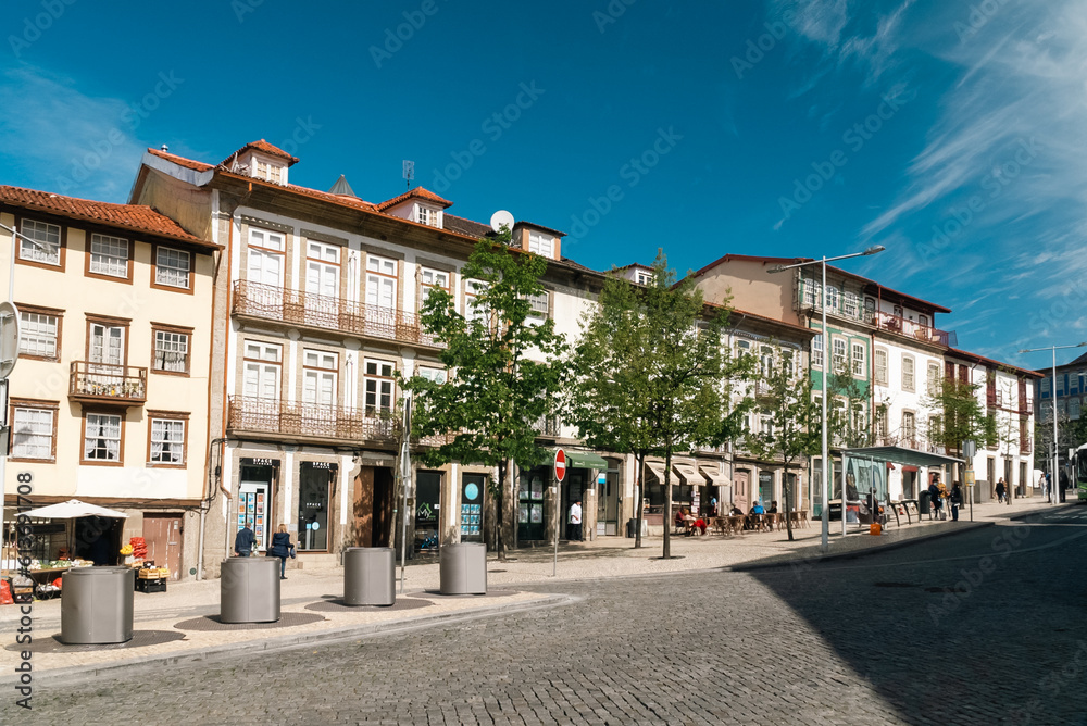 Guimaraes, Portugal. April 14, 2022: Architecture and facade of the city Guimaraes with blue sky.