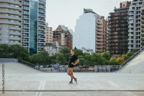 general shot of a teenage girl looking at the camera in the middle of the city © juanealvarez