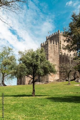 Guimaraes, Portugal. April 14, 2022: Walls and structures of Guimarães castle with blue sky.