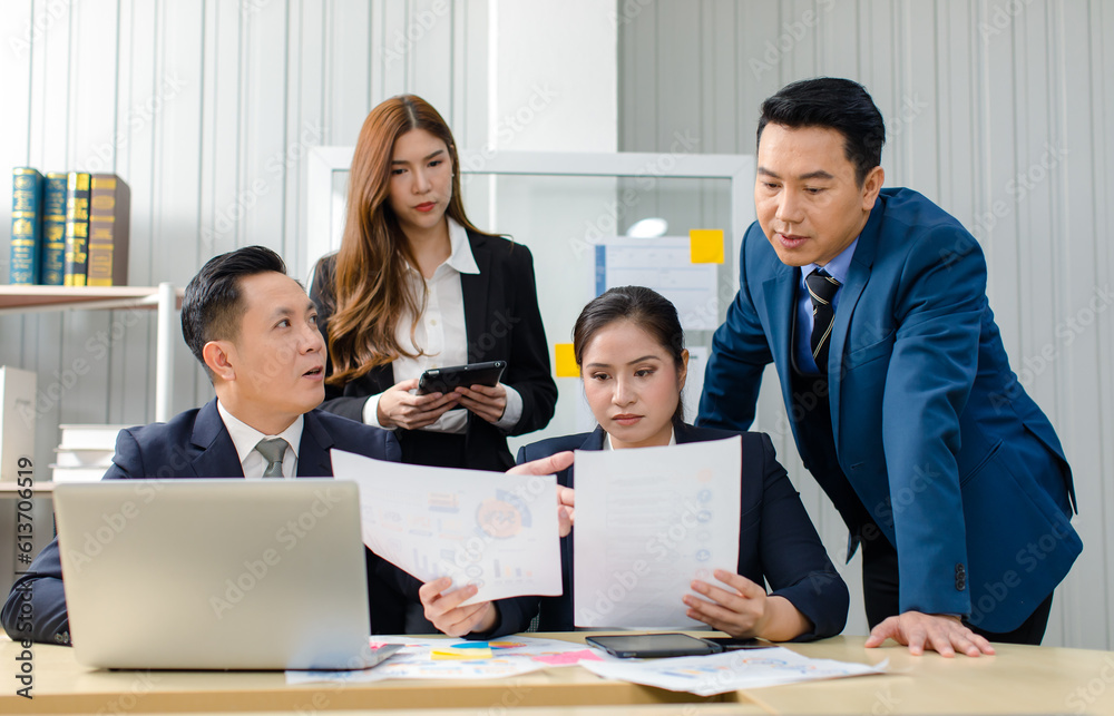 Asian professional successful male female businessmen businesswomen in formal business suit sitting standing talking in video call meeting online in laptop notebook computer Asian professional successful male female businessmen businesswomen in formal business suit sitting standing talking in video call meeting online in laptop notebook computer