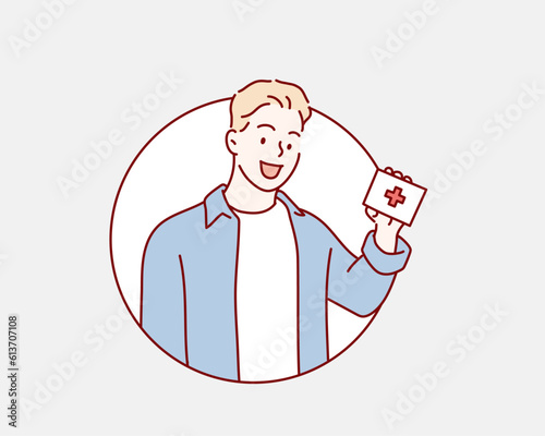 man holds in his hands a first aid kit. Hand drawn style vector design illustrations.