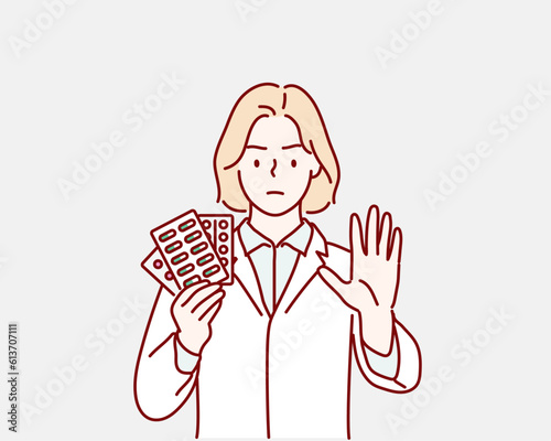 doctor hold pill with stop gesture. stop taking medication. Hand drawn style vector design illustrations.