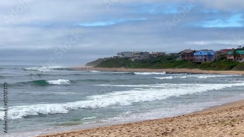 Summer surfers JBAY Jefferys Bay South Africa surf wave Supers Impossibles Boneyard WSL Corona Open waves crashing on beach slow motion pan to the right photo