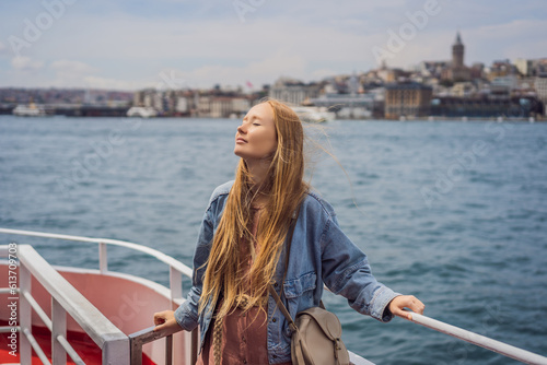 Photography Happy woman enjoying the sea from ferry boat crossing Bosphorus in Istanbul