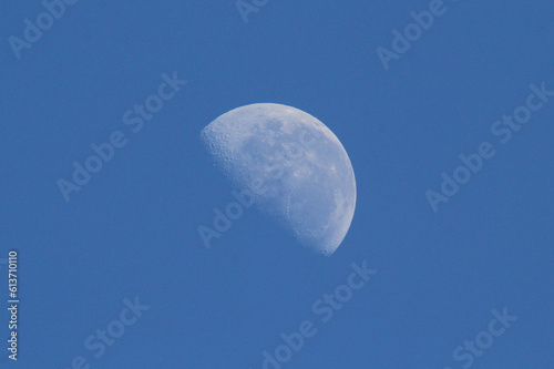 Close up of the moon against the blue sky