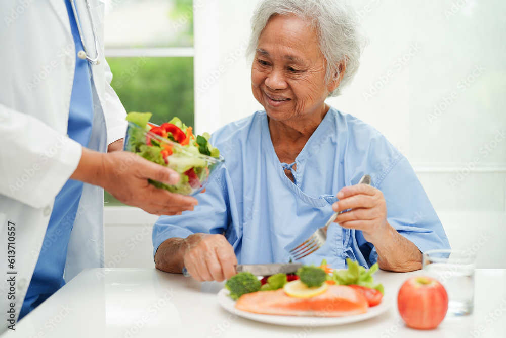 Asian Nutritionist holding healthy food for patient in hospital, nutrition and vitamin. Asian Nutritionist holding healthy food for patient in hospital, nutrition and vitamin.