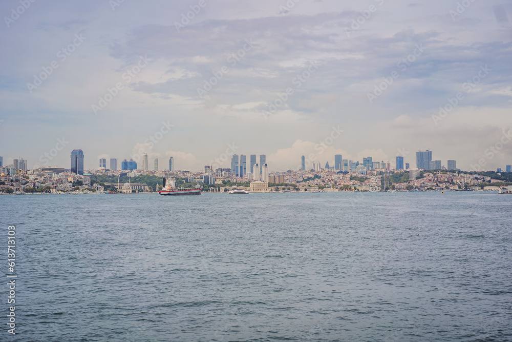 Istanbul at sunset, Turkey. Tourist boat sails on Golden Horn in summer. Beautiful sunny view of Istanbul waterfront with old mosque. Concept of travel, tourism and vacation in Istanbul and Turkey Istanbul at sunset, Turkey. Tourist boat sails on Golden Horn in summer. Beautiful sunny view of Istanbul waterfront with old mosque. Concept of travel, tourism and vacation in Istanbul and Turkey