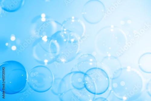 Beautiful Transparent Blue Soap Bubbles Floating in The Air. Abstract Background. Celebration Festive Backdrop. Freshness Soap Suds Bubbles Water 