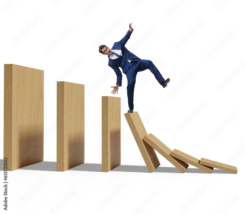 Businessman in domino effect concept Businessman in domino effect concept