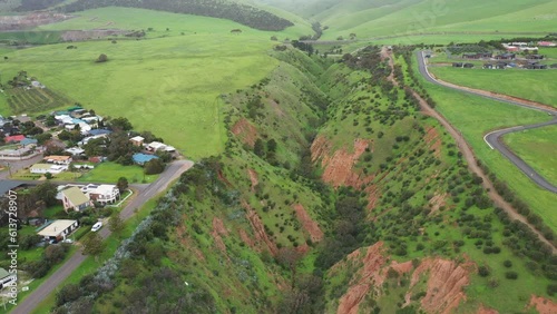 Aerial view flying over Cactus Canyon with a pan down into the valley. Adelaide, Australia. photo