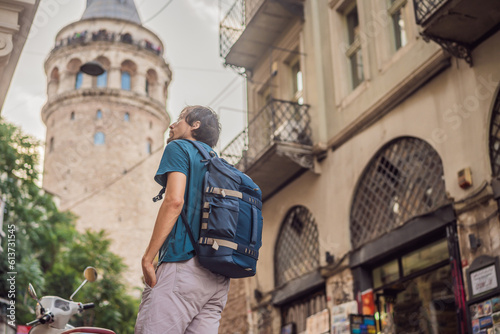 Portrait of man tourist with view of Galata tower in Beyoglu, Istanbul, Turkey. Turkiye