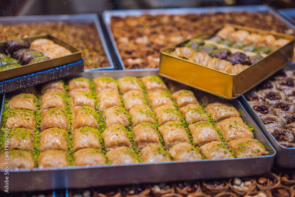 Traditional oriental sweet pastry cookies, nuts, dried fruits, pastilles, marmalade, Turkish desert with sugar, honey and pistachio, in display at a street food market