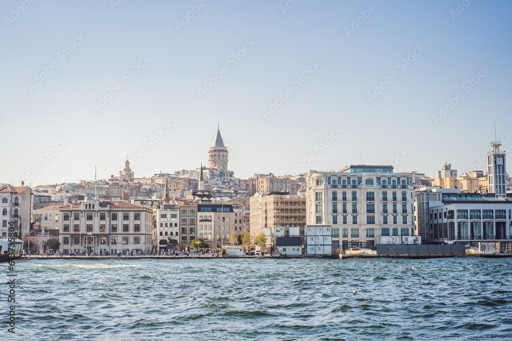 Istanbul city skyline in Turkey, Beyoglu district old houses with Galata tower on top, view from the Golden Horn
