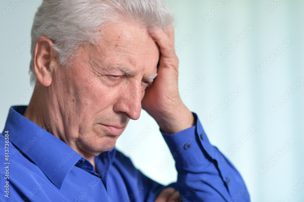Portrait of sad sick old man with headache Portrait of sad sick old man with headache