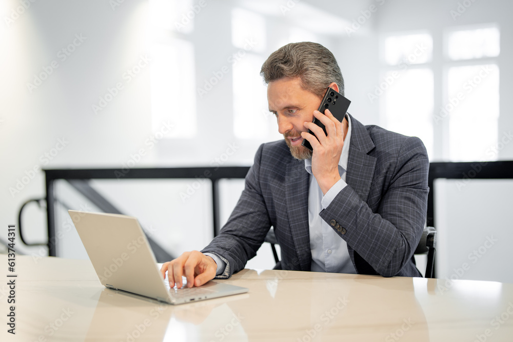 Business office interior. Businessman chatting phone online in office. Business man in suit using phone. Office worker solves cases on phone. Office manager talk phone. Ceo manager using smartphone. Business office interior. Businessman chatting phone online in office. Business man in suit using phone. Office worker solves cases on phone. Office manager talk phone. Ceo manager using smartphone.