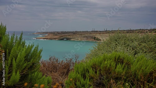 Natural formed Hofriet Window and wide view of bay, time lapse view photo