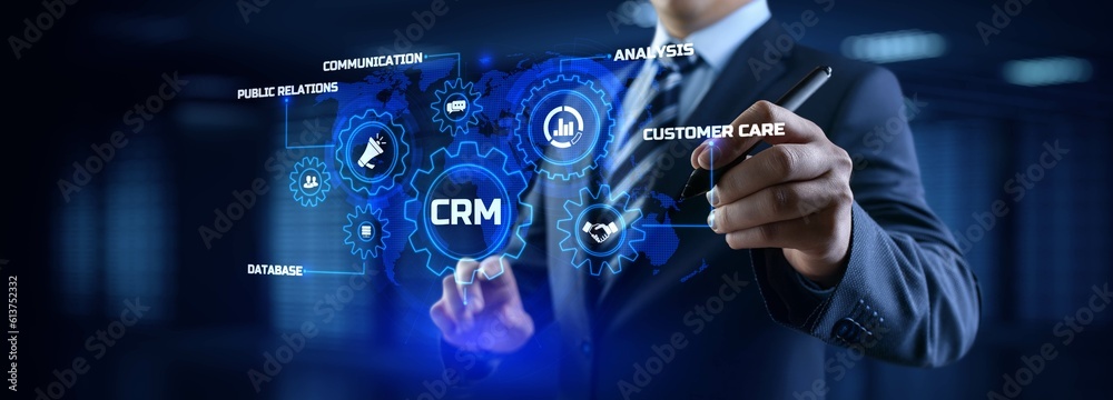 Fototapeta premium CRM Customer relationship management concept. Businessman pressing button on screen.