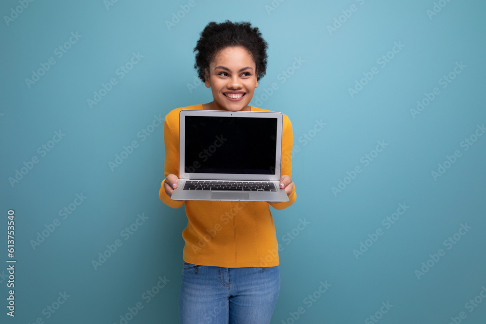 confident smart young 25 year old hispanic business lady with afro with a laptop in her hands confident smart young 25 year old hispanic business lady with afro with a laptop in her hands
