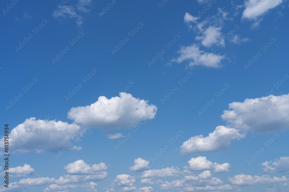 white fluffy clouds standing out against a black background and a blue sky white fluffy clouds standing out against a black background and a blue sky