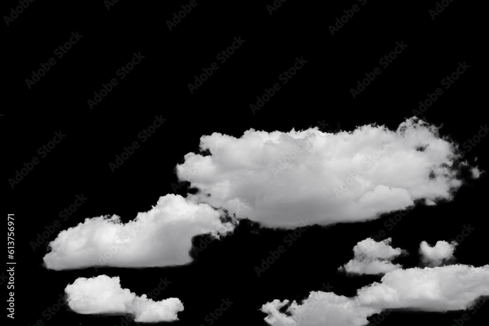 white fluffy clouds standing out against a black background and a blue sky