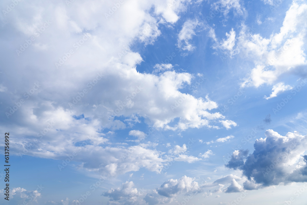 white fluffy clouds standing out against a black background and a blue sky white fluffy clouds standing out against a black background and a blue sky