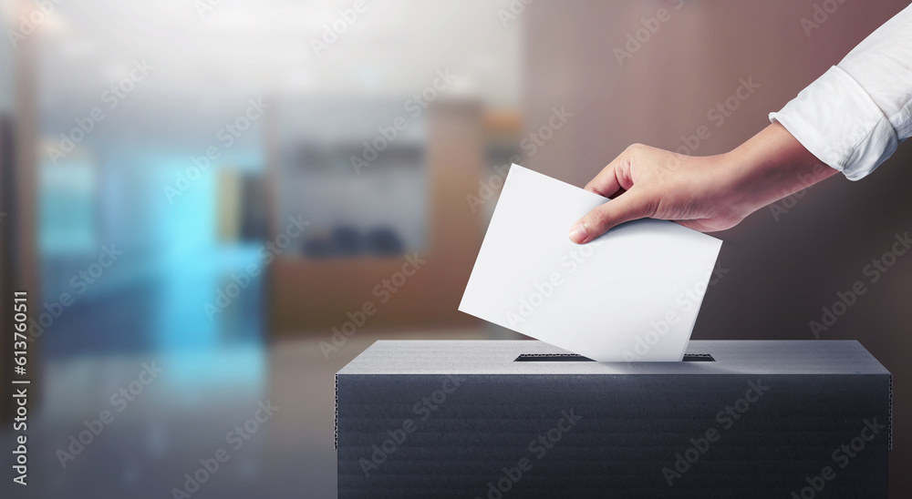 Hand holding ballot paper for election vote, Election concept. - obrazy, fototapety, plakaty 