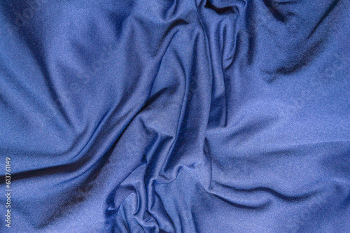Synthetic wrinkled blue fabric as texture, pattern, background