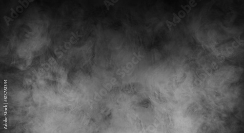 Abstract smoke texture over black. Fog in the darkness.