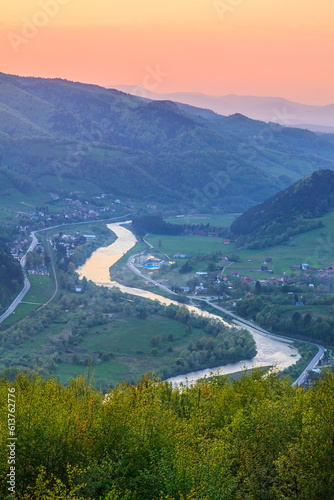 Obraz na płótnie Evening view of the Poprad river valley and Piwniczna-Zdrój in Beskid Sądecki, Poland w salonie
