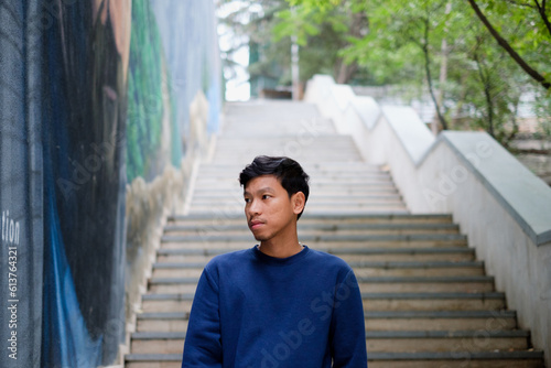 Portrait Asian man Blue clothes city street