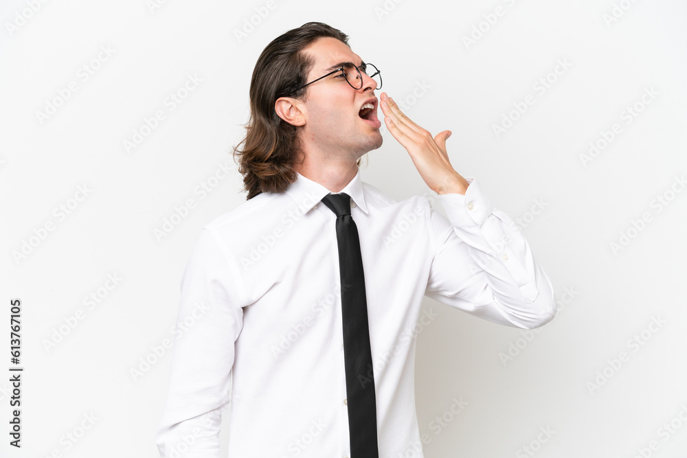 Business handsome man isolated on white background yawning and covering wide open mouth with hand