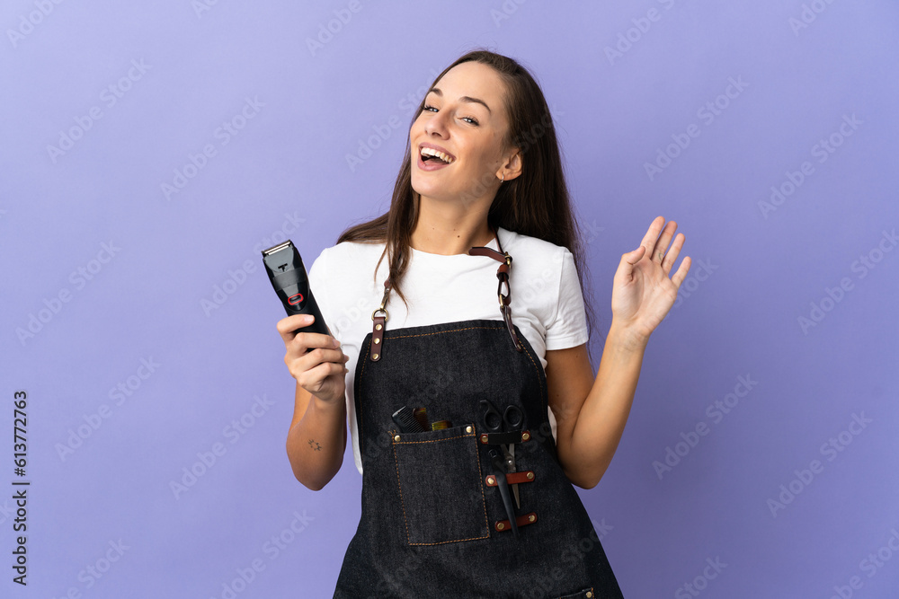 Young hairdresser woman over isolated background saluting with hand with happy expression Young hairdresser woman over isolated background saluting with hand with happy expression