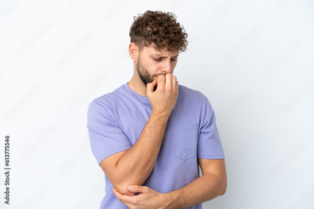Young handsome caucasian man isolated on white background having doubts Young handsome caucasian man isolated on white background having doubts