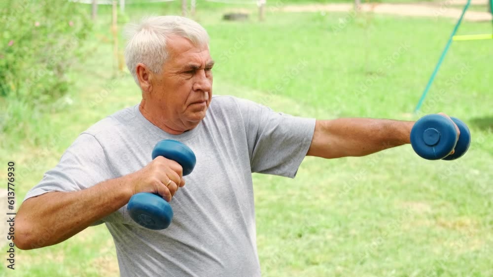 Senior man working out outdoors. Person lifting dumbbells. Old male exercising at park. Healthy people lifestyle. Active sport training. Older elderly sportsman doing fitness exercise. Workout session Senior man working out outdoors. Person lifting dumbbells. Old male exercising at park. Healthy people lifestyle. Active sport training. Older elderly sportsman doing fitness exercise. Workout session