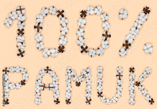 Lettering 100% pamuk from Turkish language means cotton, made of cotton flowers. Concept of organic raw material. photo