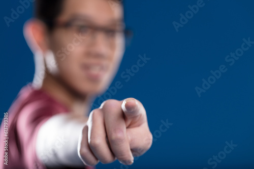 Focused fingertip, blurry Asian, touch graphics