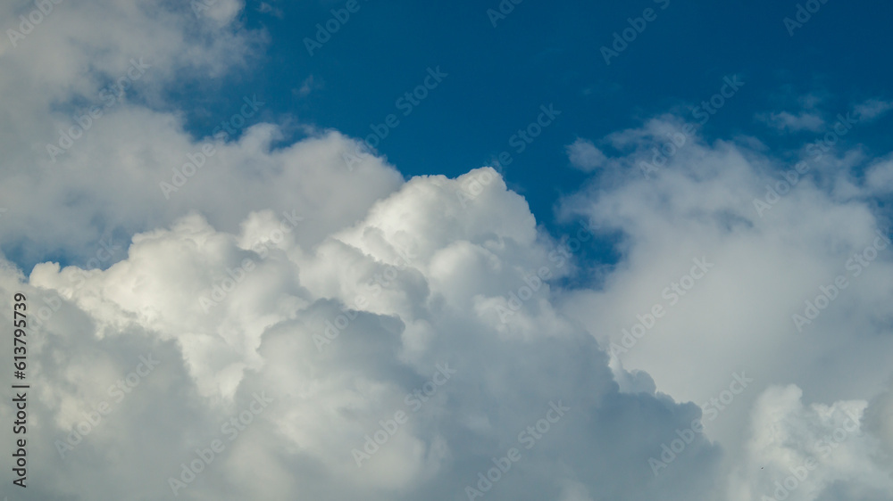 Blue clouds in the sky. White fluffy clouds. Clouds close-up Blue clouds in the sky. White fluffy clouds. Clouds close-up