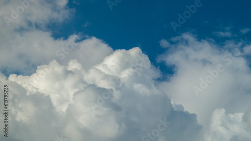 Blue clouds in the sky. White fluffy clouds. Clouds close-up