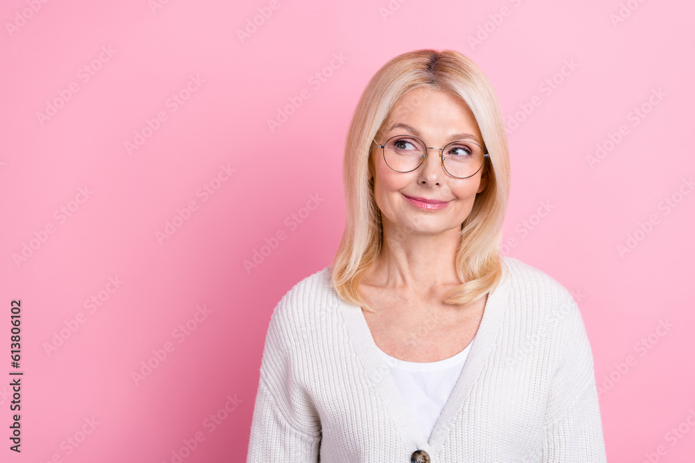 Photo of nice creative minded lady look interested empty space contemplate isolated on pink color background Photo of nice creative minded lady look interested empty space contemplate isolated on pink color background